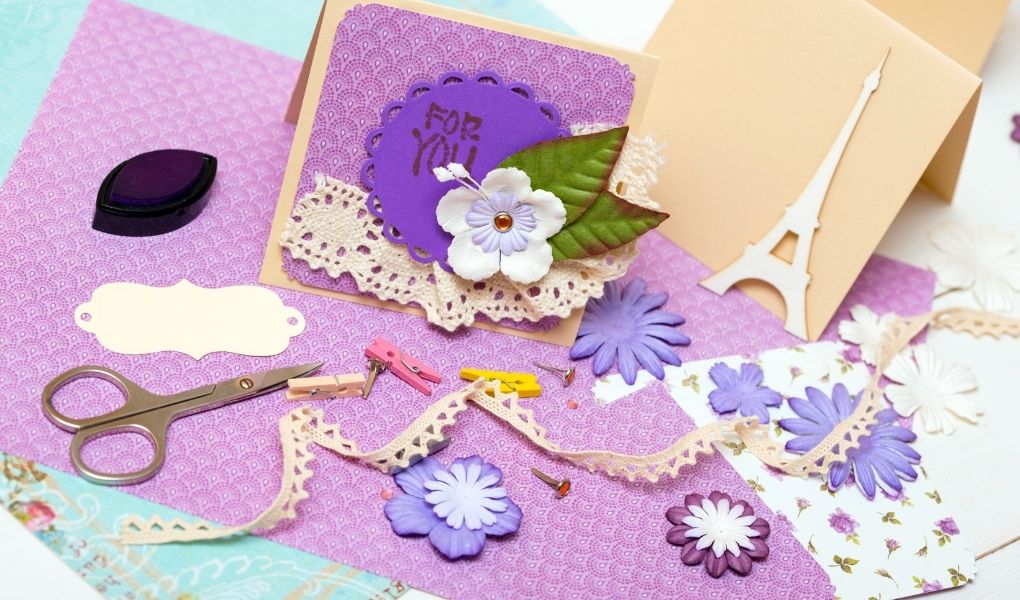 make a pet memorial scrapbook-scraping items in shades of purple